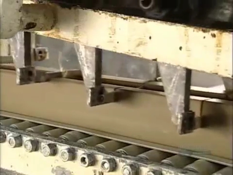 soap bars being sliced in shorter called slugs